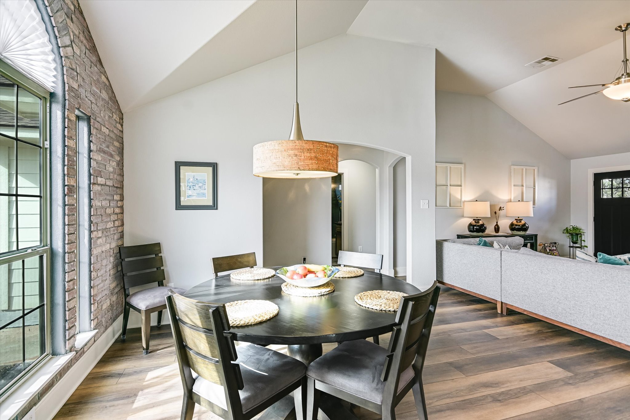 18516 Champions Circle Lago Vista, TX 78645 - Photo 12 of 30 a view of a dining room with furniture and wooden floor