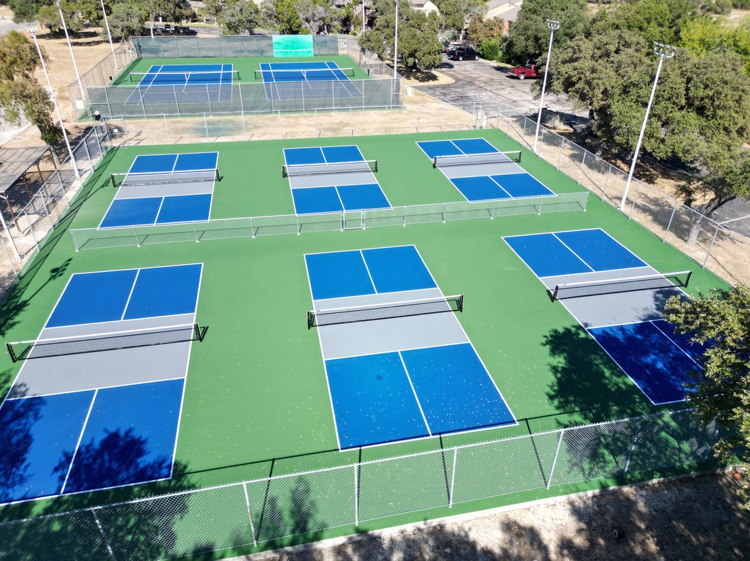 18516 Champions Circle Lago Vista, TX 78645 - Photo 22 of 30 a view of backyard with outdoor space and swimming pool