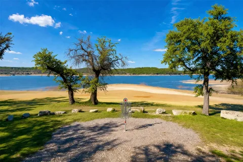 a view of a lake with a yard