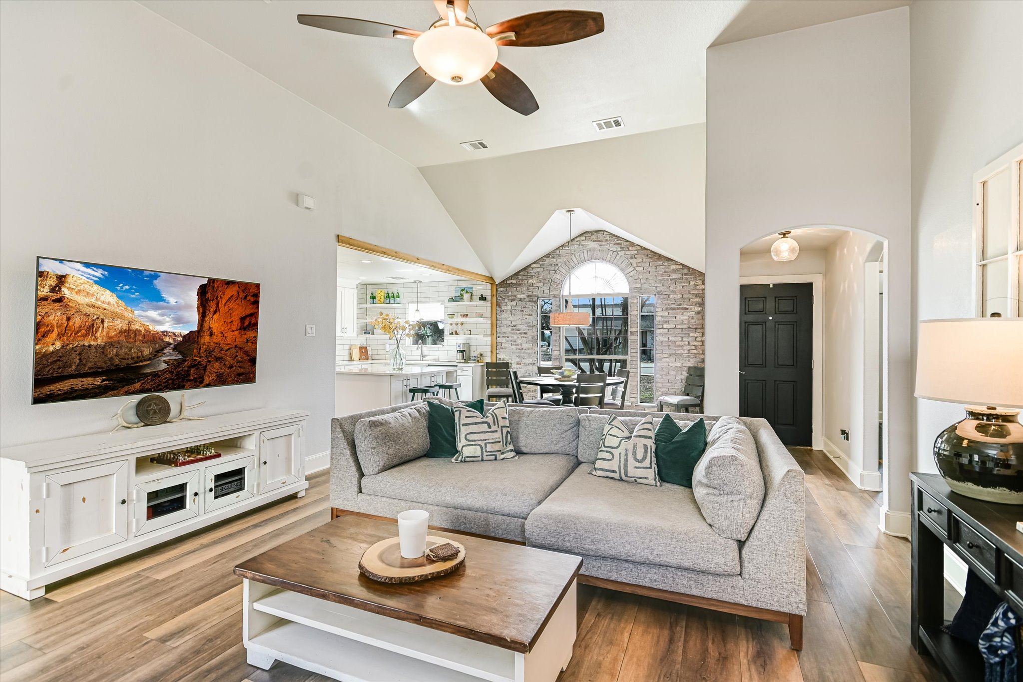 18516 Champions Circle Lago Vista, TX 78645 - Photo 30 of 30 a living room with furniture and a flat screen tv