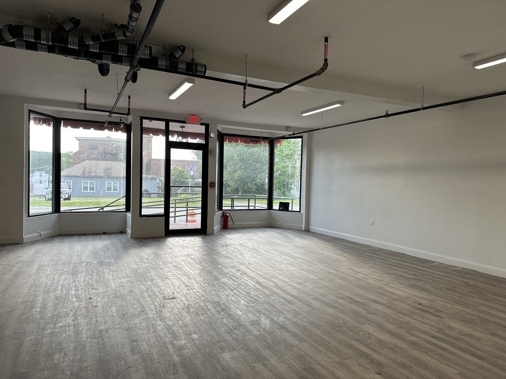 311-313 Providence Road Grafton, MA 01560 - Photo 12 of 21 a view of an empty room with a large window