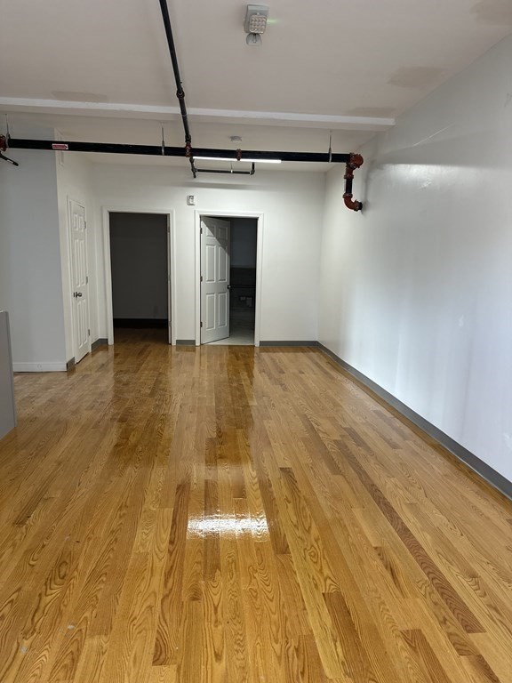 311-313 Providence Road Grafton, MA 01560 - Photo 15 of 21 a view of an empty room with a chandelier