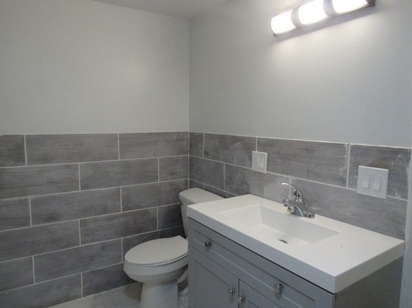 311-313 Providence Road Grafton, MA 01560 - Photo 16 of 21 a bathroom with a sink toilet and a mirror