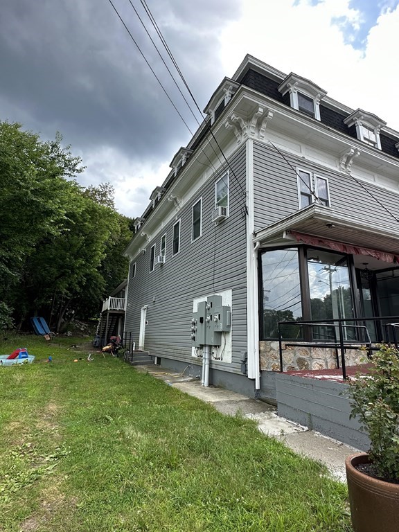 311-313 Providence Road Grafton, MA 01560 - Photo 2 of 21 a front view of a house with a yard