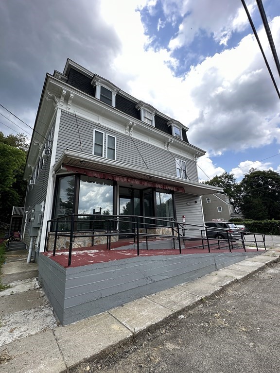 311-313 Providence Road Grafton, MA 01560 - Photo 3 of 21 a view of outdoor space yard deck patio and outdoor seating