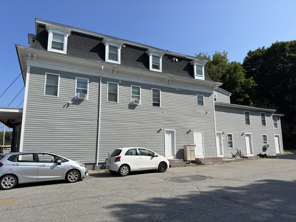 311-313 Providence Road Grafton, MA 01560 - Photo 6 of 21 a view of a car park in front of house