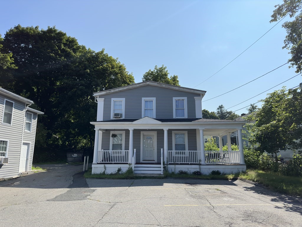 311-313 Providence Road Grafton, MA 01560 - Photo 7 of 21 a front view of a house with a garden