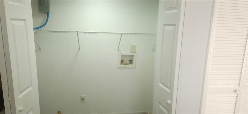 5582 Windwood Road Atlanta, GA 30349 - Photo 11 of 29 a bathroom with a shower