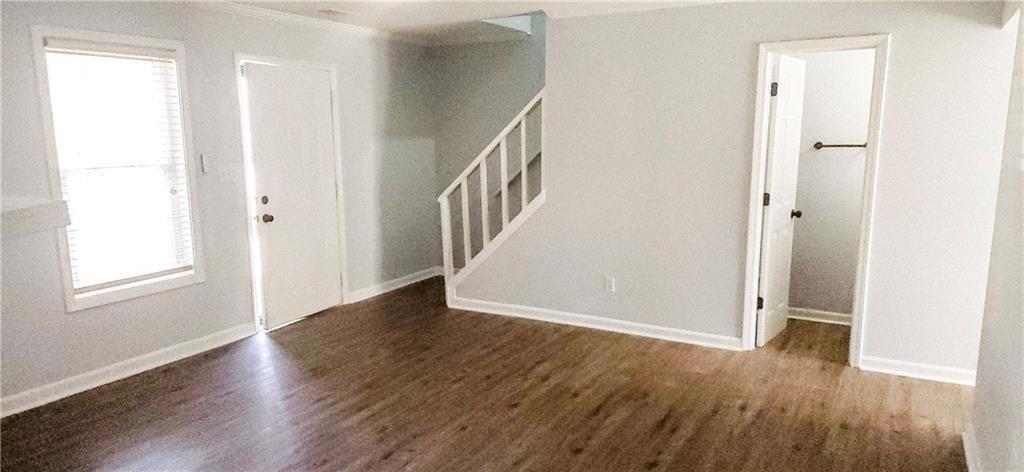 5582 Windwood Road Atlanta, GA 30349 - Photo 13 of 29 a view of an entryway with wooden floor