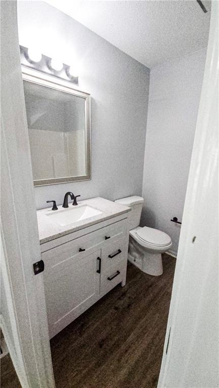 5582 Windwood Road Atlanta, GA 30349 - Photo 16 of 29 a bathroom with a sink mirror and toilet