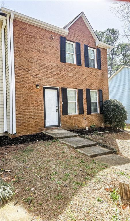 5582 Windwood Road Atlanta, GA 30349 - Photo 2 of 29 a front view of a house with a yard