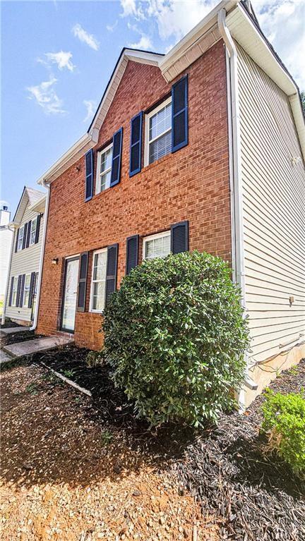 5582 Windwood Road Atlanta, GA 30349 - Photo 3 of 29 a front view of a house with a yard