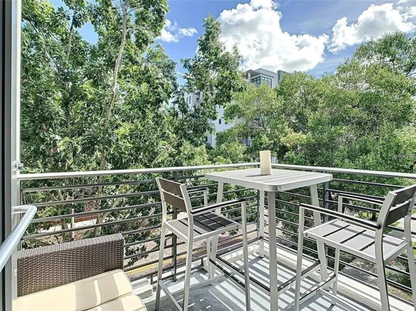 a view of a chairs and table on the terrace