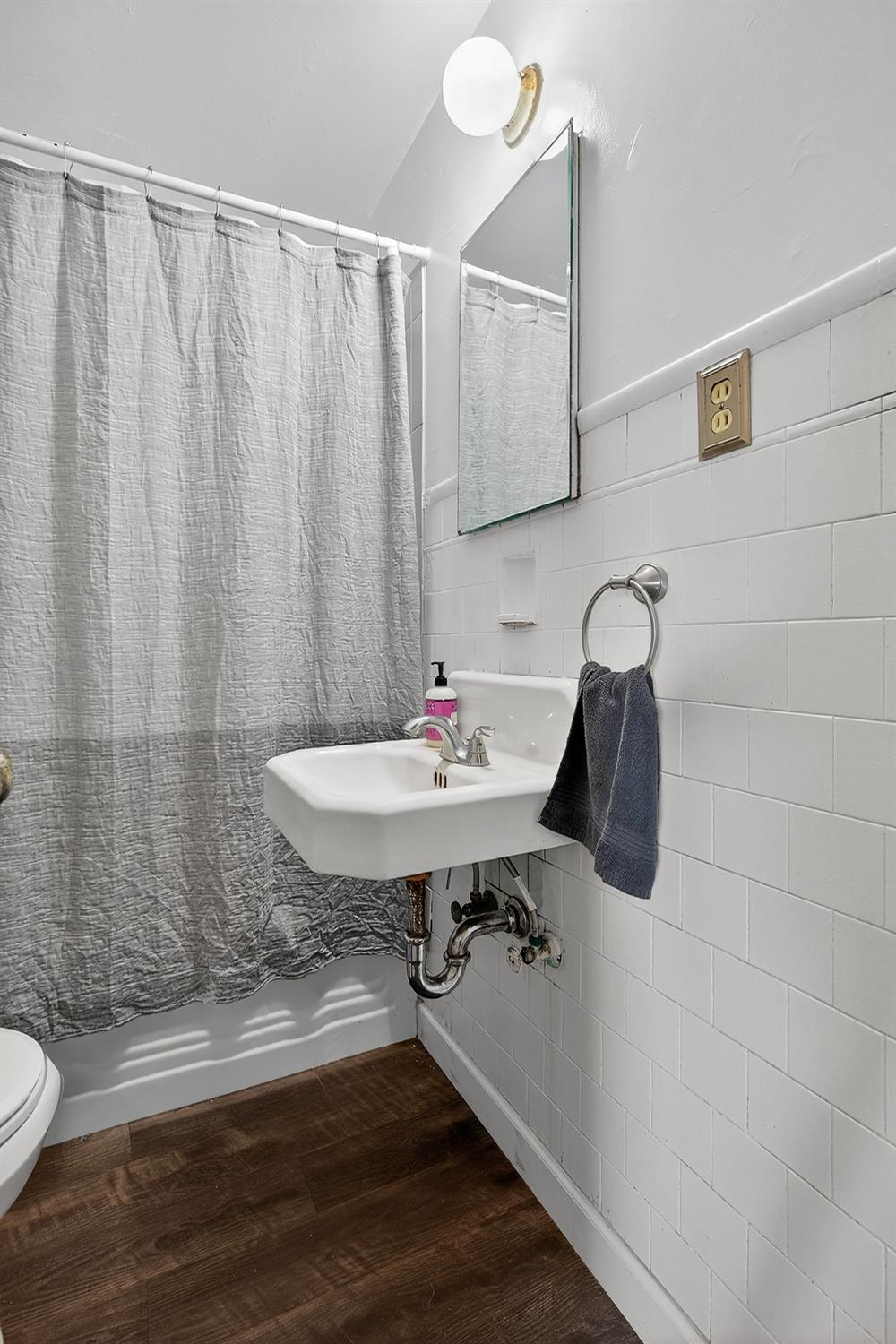 28015 Blossom Road Thornton, CA 95686 - Photo 11 of 34 a bathroom with a sink toilet and shower