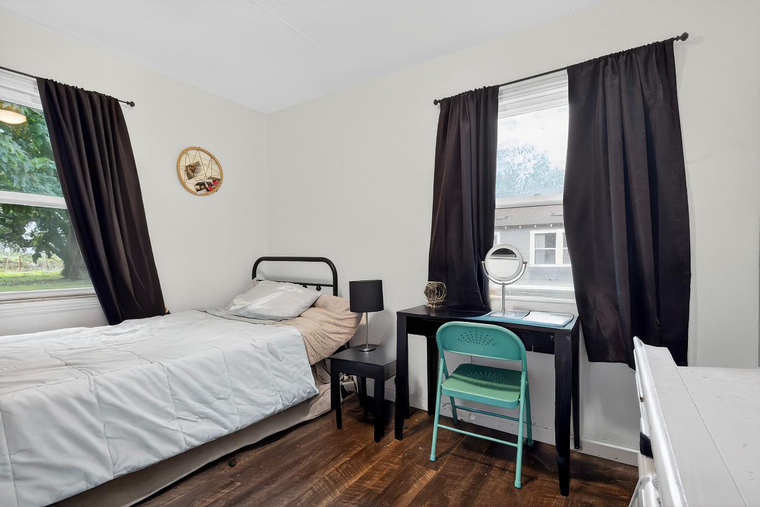 28015 Blossom Road Thornton, CA 95686 - Photo 12 of 34 a bedroom with a bed and a window