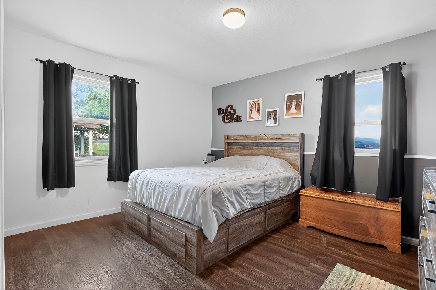 28015 Blossom Road Thornton, CA 95686 - Photo 13 of 34 a bedroom with a large bed and a window