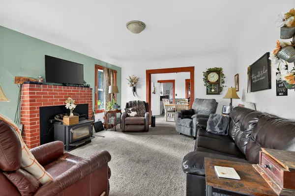 a living room with furniture flat screen tv and a fireplace