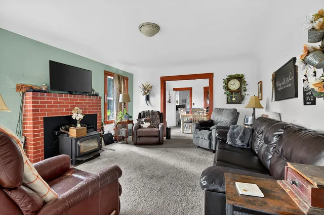 a living room with furniture flat screen tv and a fireplace