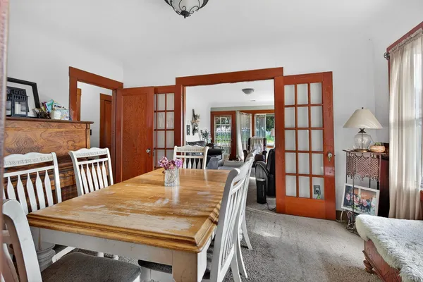 a view of a dining room with furniture window and wooden floor