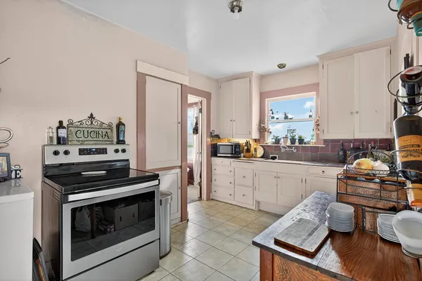 a kitchen with a stove and a sink