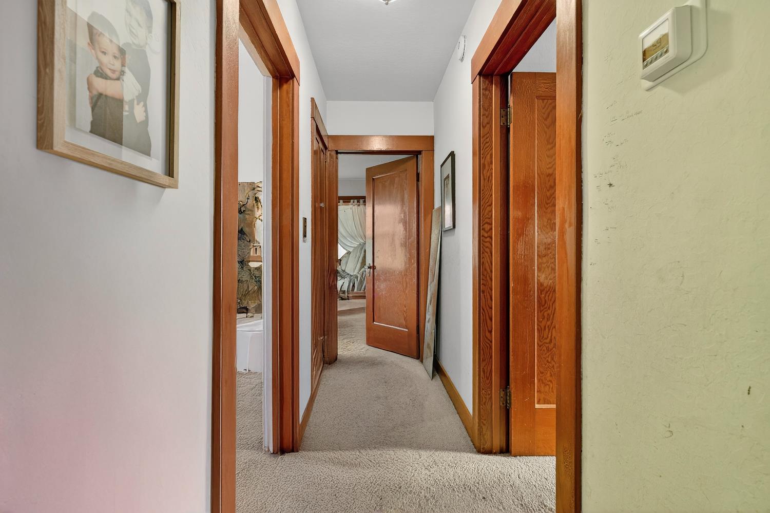 28015 Blossom Road Thornton, CA 95686 - Photo 22 of 34 a view of a hallway with wooden floor and entryway