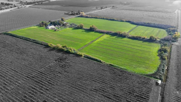 a view of a golf course with a wooden fence