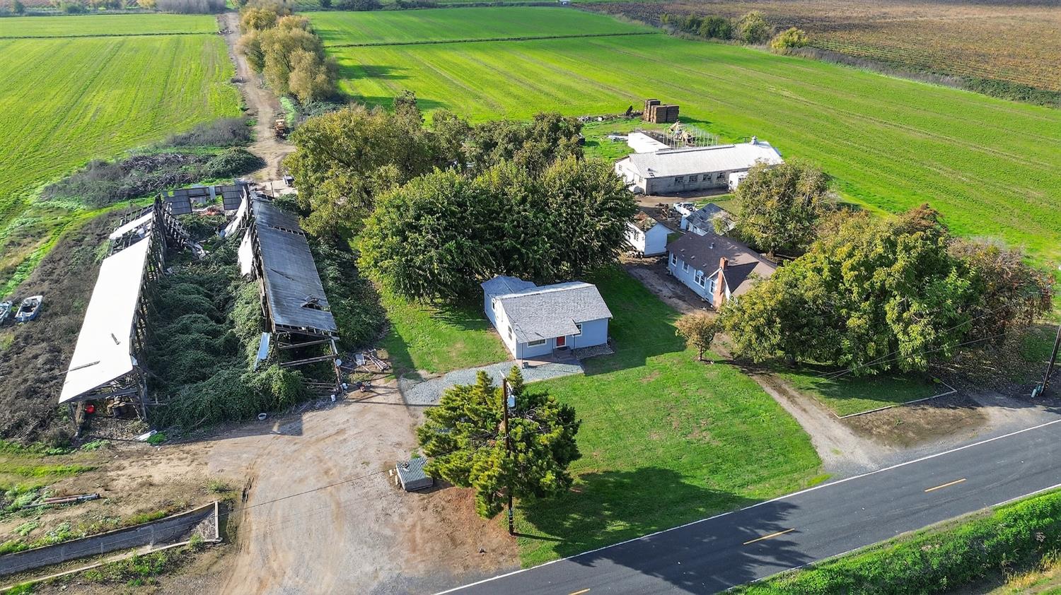 28015 Blossom Road Thornton, CA 95686 - Photo 30 of 34 an aerial view of a house with a garden
