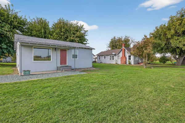 a house view with a garden space