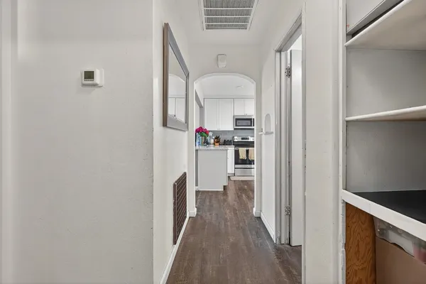 a view of a kitchen from the hallway