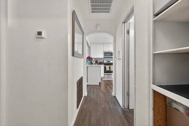 a view of a kitchen from the hallway
