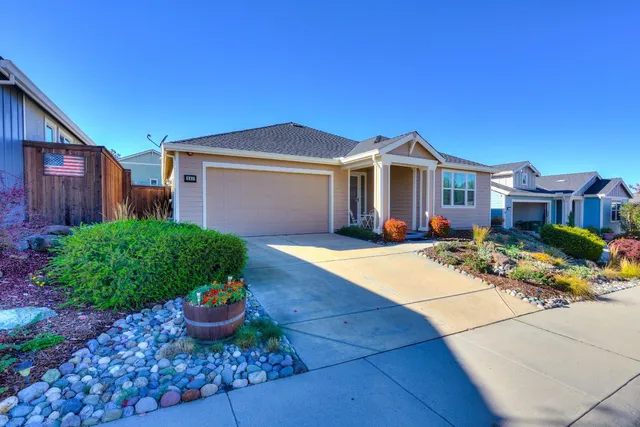 a front view of a house with porch and entertaining space