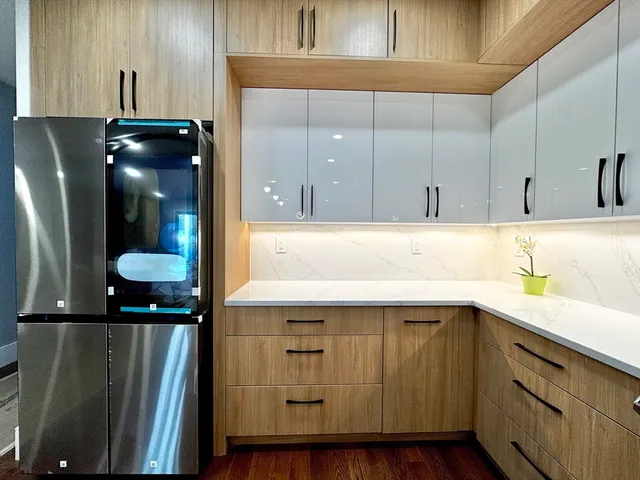 a kitchen with a sink and a refrigerator