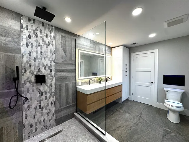 a bathroom with a bathtub sink and toilet