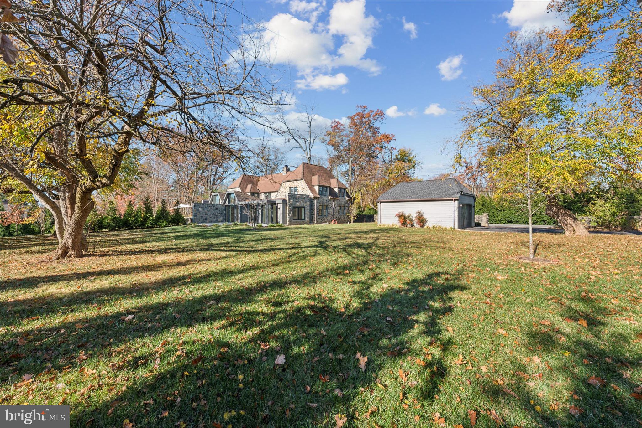 767-769 Newtown Road Villanova, PA 19085 - Photo 6 of 26 a front view of a house with a yard