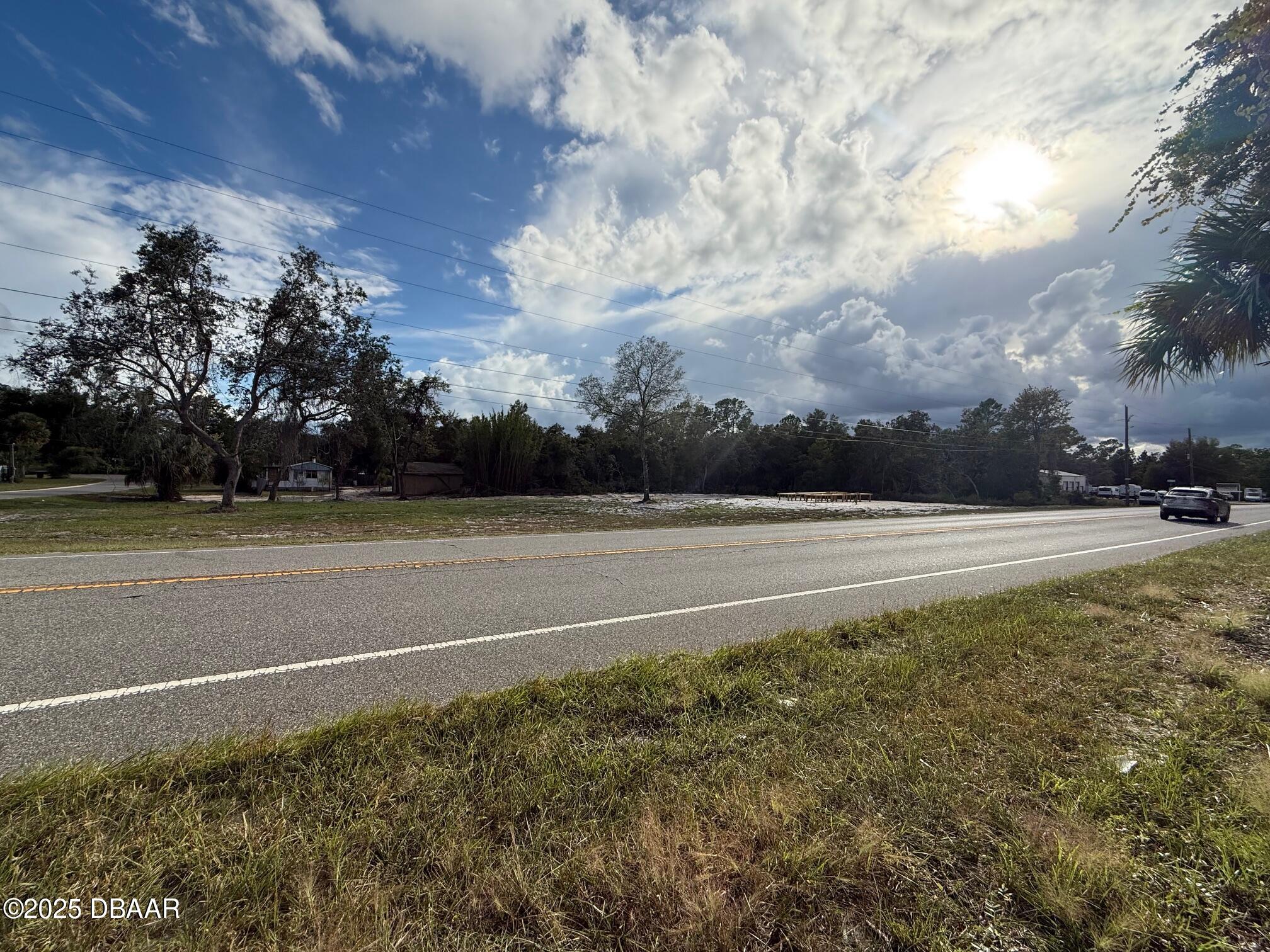 0 County Road Road, Unit COUNTY Umatilla, FL 32784 - Photo 2 of 6 a view of a green field