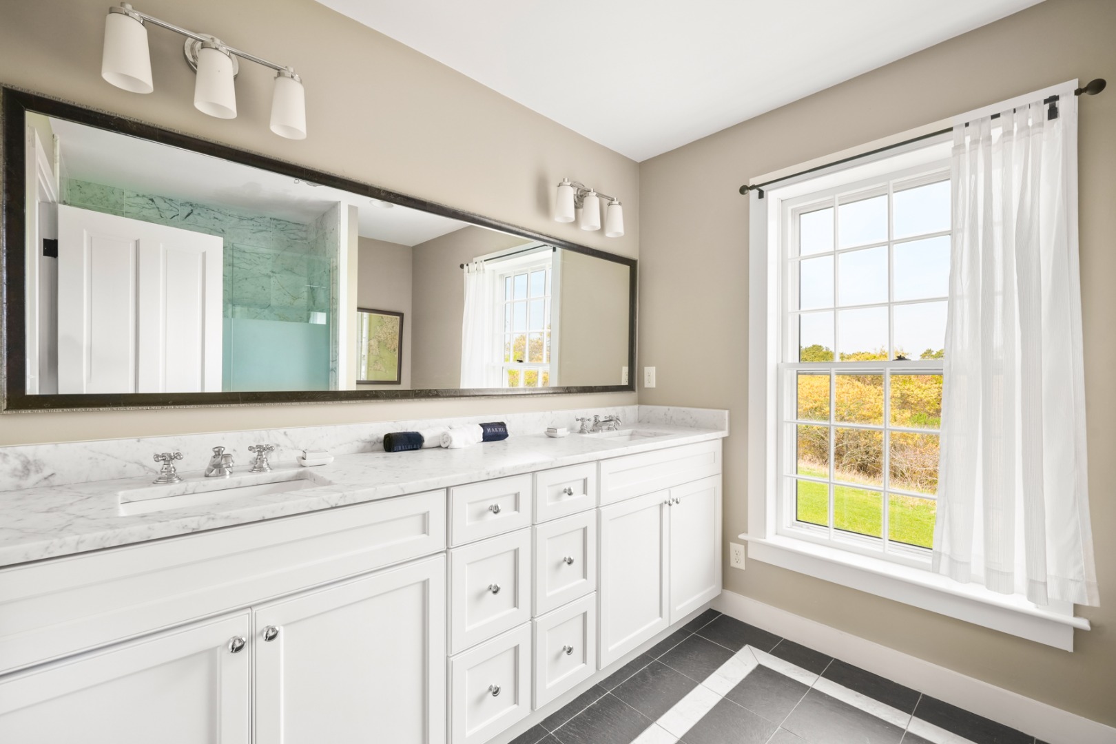 21 Quidnet Road Nantucket, MA 02554 - Photo 42 of 62 a bathroom with a granite countertop sink mirror and a window