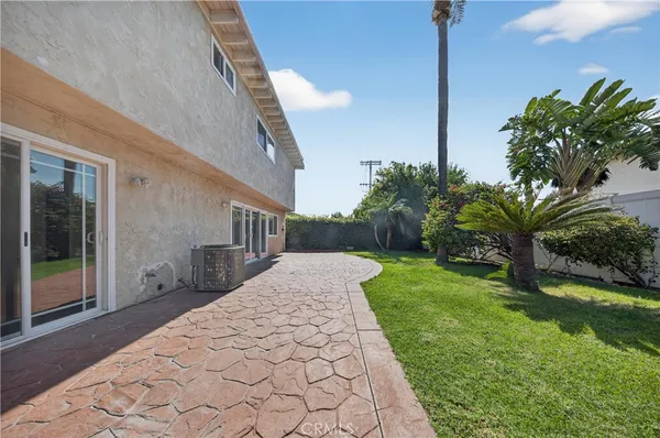 a view of a backyard of the house