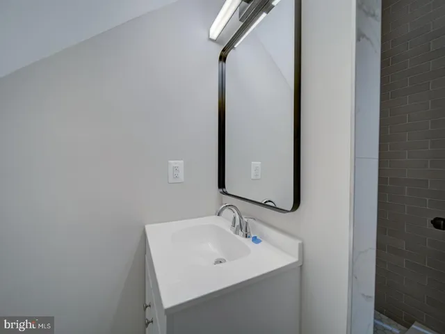 a view of an empty room and wooden floor