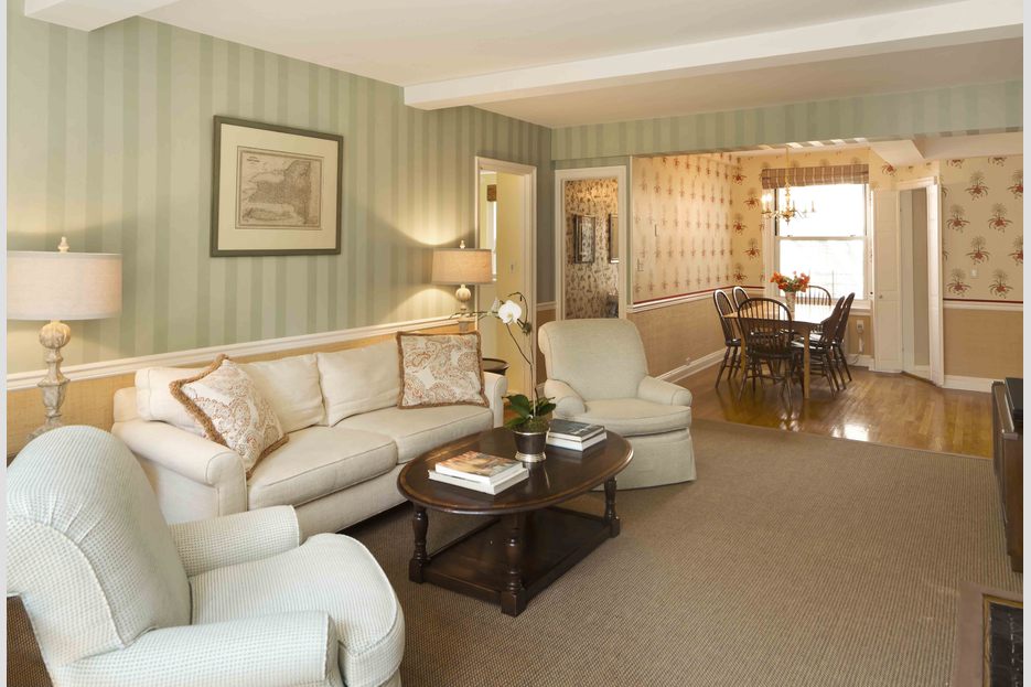 215 East 73rd Street, Unit 9C Manhattan, NY 10021 - Photo 1 of 1 a living room with furniture and a large window