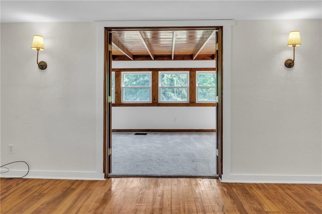 116 Purvis Lane Valencia, PA 16059 - Photo 11 of 49 an empty room with wooden floor and windows