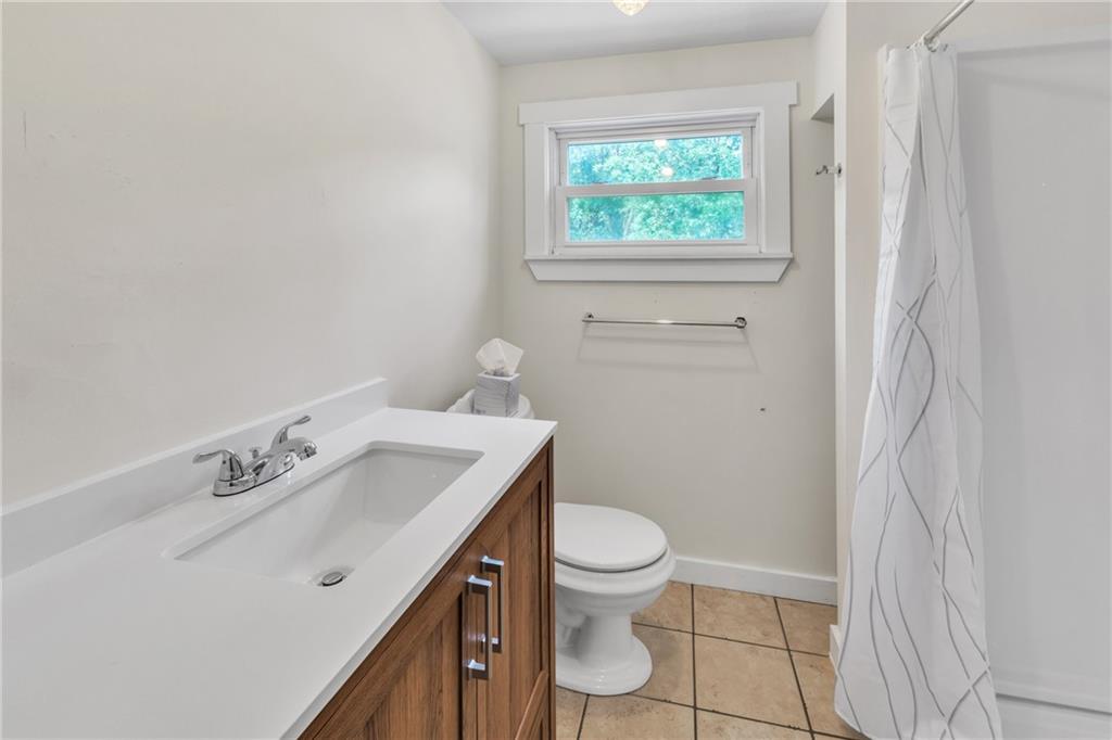 116 Purvis Lane Valencia, PA 16059 - Photo 22 of 49 a bathroom with a sink a toilet and a window