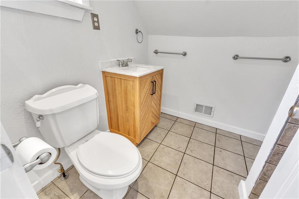 116 Purvis Lane Valencia, PA 16059 - Photo 27 of 49 a bathroom with a toilet and a washing machine in it