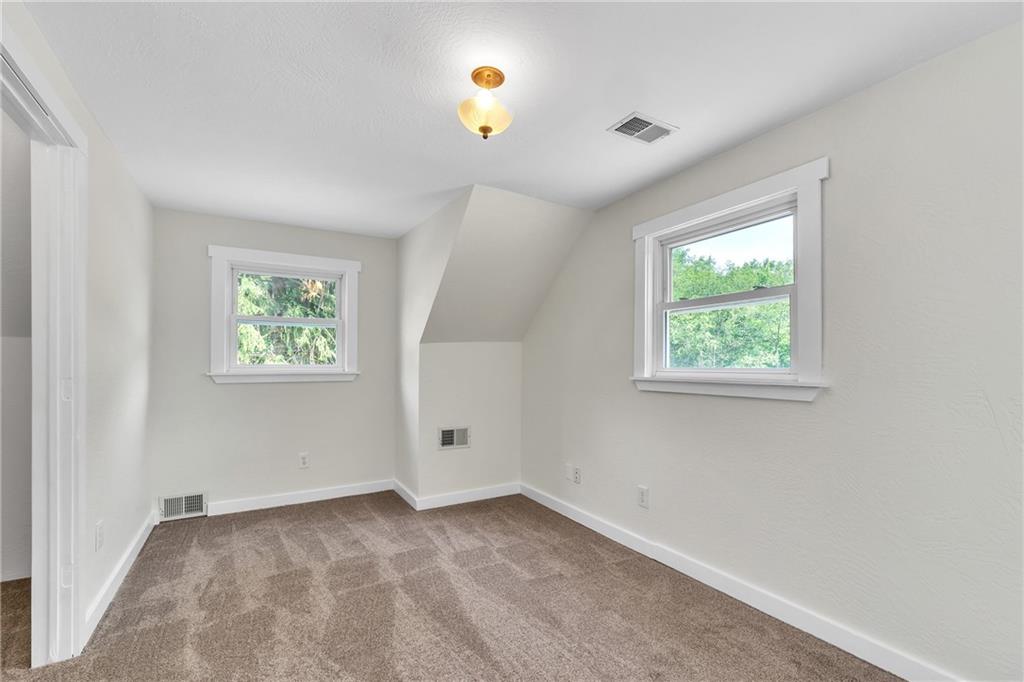 116 Purvis Lane Valencia, PA 16059 - Photo 32 of 49 an empty room with a window and a ceiling fan