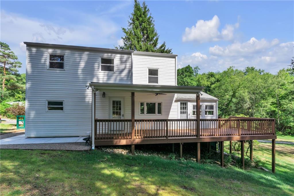 116 Purvis Lane Valencia, PA 16059 - Photo 42 of 49 a front view of a house with a garden and deck