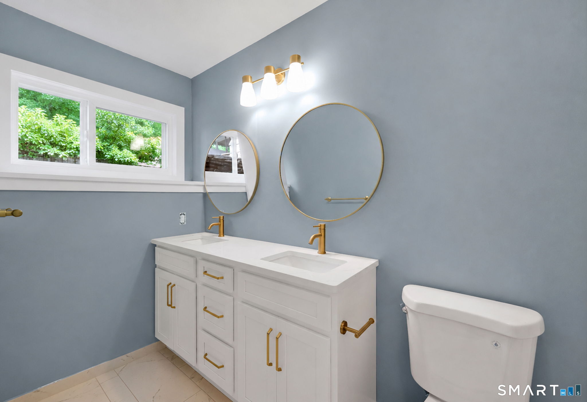 49 Millstone Road Glastonbury, CT 06033 - Photo 20 of 39 a bathroom with a toilet sink and mirror
