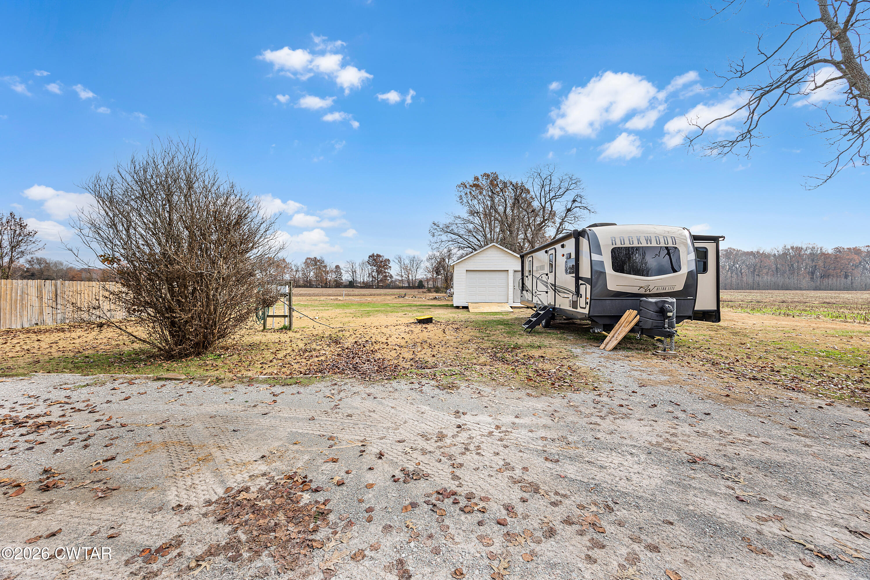 31 Turkey Creek Road Medina, TN 38355 - Photo 27 of 30 a view of a backyard with a garden and fire pit