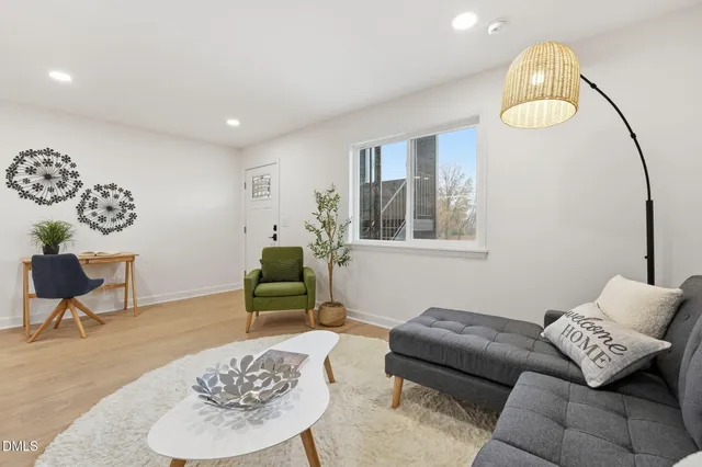a living room with furniture and a table