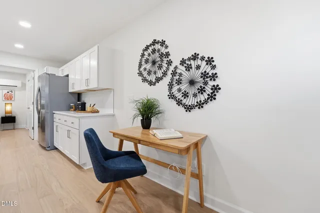 a view of kitchen with furniture and wooden floor
