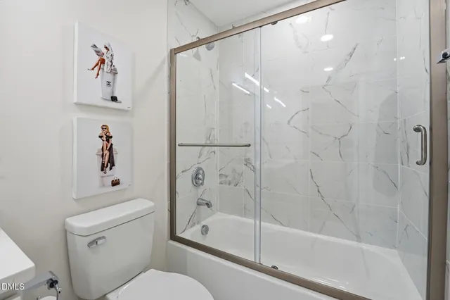 a bathroom with a shower and a toilet