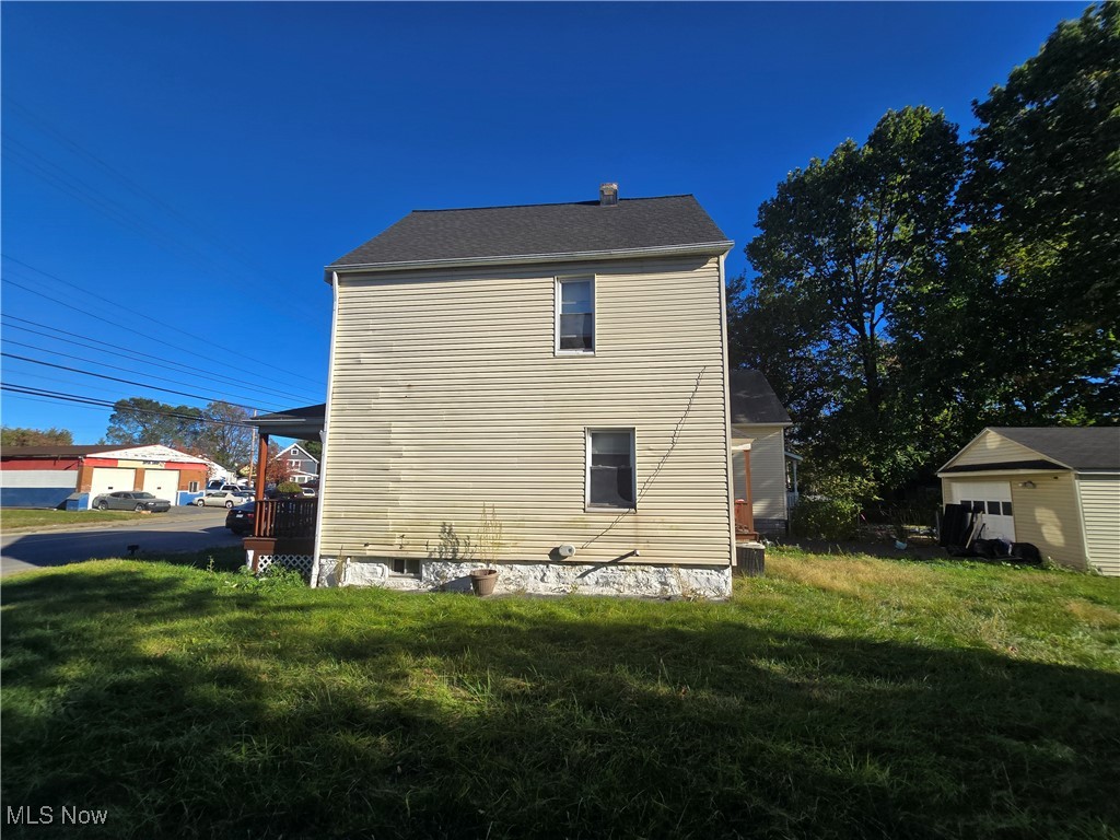 3616 Independence Road Cleveland, OH 44105 - Photo 6 of 10 View of side of home with a yard and an outdoor structure